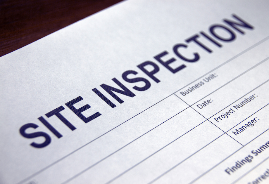 Close-up of a site inspection form with fields for project details and findings.